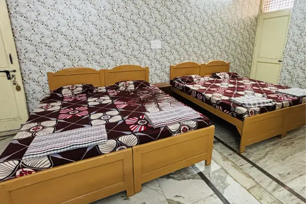 Non AC pilgrim room at Shree Akhil Bharatiya Ahir Seva Samaj Trust Dwarka Gujarat